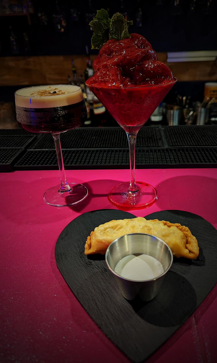 Espresso Martini, frozen strawberry Margarita and a crispy Pockerotti with dip on a heart-shaped slate